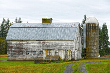 Old wooden barn and storage silo, USA