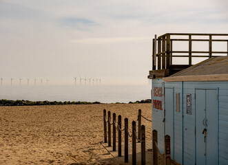 Wooden beach patrol hut on the sandy beach in the coastal town of Clacton-on-Sea, Essex