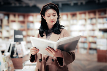 Young Woman Enjoys Reading in Cozy Bookstore