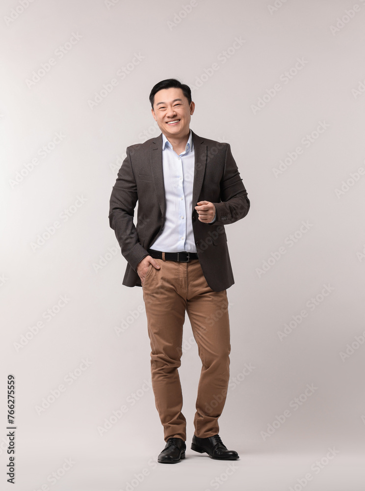 Poster Full length portrait of happy man on light background. Space for text