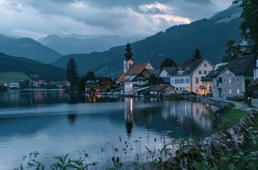 Fototapeta na wymiar A picturesque view of Hall slammed, Austria with its iconic church and lake surrounded by mountains at dusk