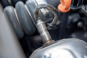 Cars oxygen sensor on an exhaust manifold - obrazy, fototapety, plakaty