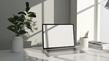 Fototapeta premium Minimalist workspace with laptop casting shadows in the soft morning light.