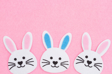 Easter bunny rabbit background on pink felt
