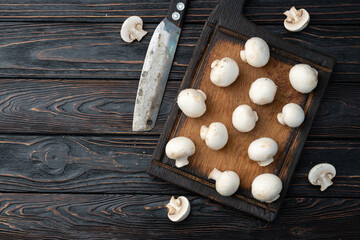 Many raw mushroom champignon  on wooden background - 766287156