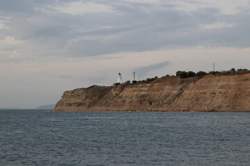 Cliffs on the sea with lighthouse.