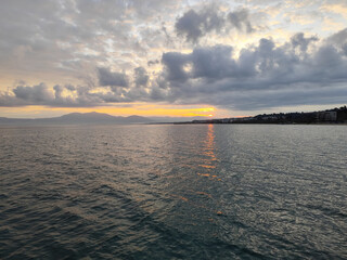 Sunrice over the sea. Beautiful clouds on the sky.