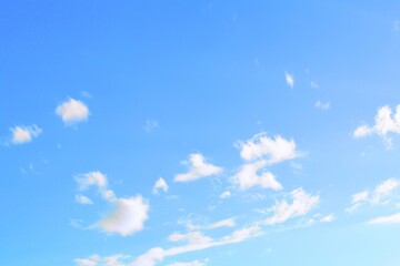 Blue sky and white clouds as background. Beautiful clear heaven with small clouds