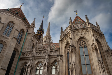 Famous historic Matthias Church in Budapest, Hungary, a must-visit landmark. Gothic architectural and decorative colorful powerful style, Catholic church with neo-Gothic style, built in 1255