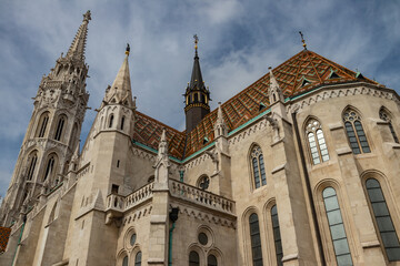 Fototapeta na wymiar Famous historic Matthias Church in Budapest, Hungary, a must-visit landmark. Gothic architectural and decorative colorful powerful style, Catholic church with neo-Gothic style