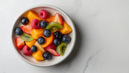 Top-down view white bowl filled with a vibrant assortment of freshly sliced fruits, mood conveyed...