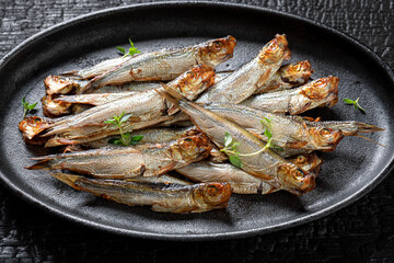 Healthy and fresh smoked sprats made in a home smokehouse. - 766308307