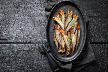 Tasty and salty smoked sprats as healthy snack. - 766309369