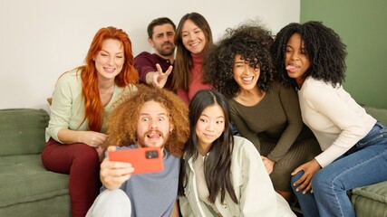 Multi-ethnic friends taking a selfie at home