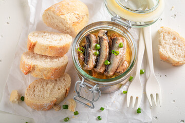 Tasty and fresh smoked sprats served with chive and bread. - 766313910