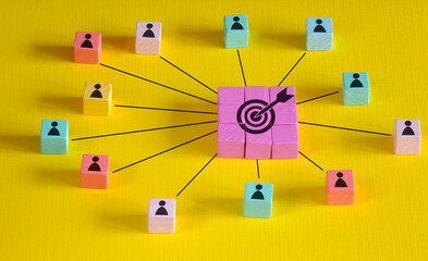 Customer relationship and teamwork concept. Multicolored wooden block with target icon linked with...