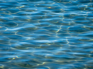Water surface in the bay of Ogliastro Marina in Italy.
