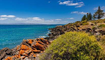 Beautiful rock formations along the coastline near Penneshaw with ferry arriving, Kangaroo Island,...
