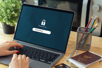 Woman hand typing password security login in laptop computer.