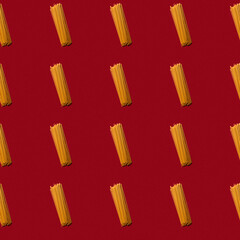 Raw pasta macaroni seamless pattern background. Vibrant and contrast red backgrorund. Hard light,...