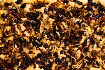 Focaccia with caramelized onions, anchovies and black olives. Italian snacking bread