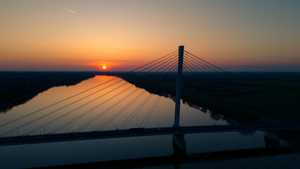 The Monostor Bridge, a stunning example of cable-stayed architecture, casts a serene silhouette...