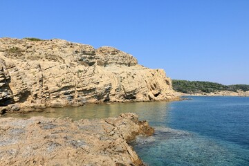 The blue sea and sandstone coast of Lopar on the island Rab, Croatia