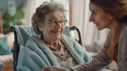 An elder woman in a wheelchair enjoys the comfort and company of a caring family member.