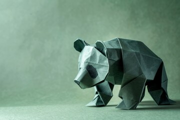 Photo of an origami Panda on pastel green background