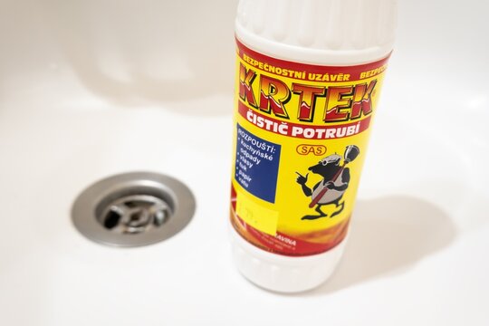 Krtek pipe cleaner bottle in white wash basin