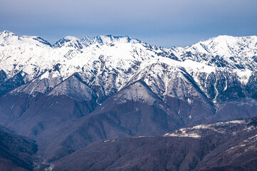 peaks of snow-capped mountains in winter - 766361330