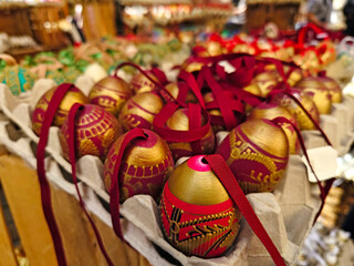 Traditional Easter market with red and gold easter eggs in Vienna - 766361783