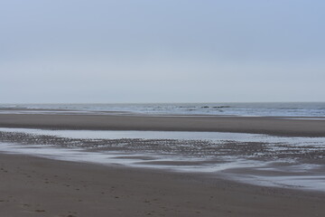 Belgium's coast in winter with sandstorms and sunshine