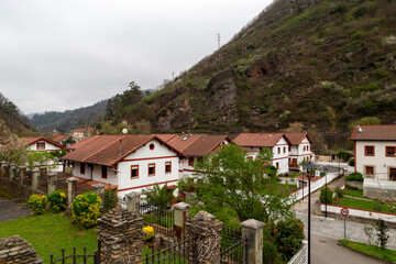 Fototapeta na wymiar View of the buildings of engineers and workers in the mining town of Bustiello. Asturias, Spain.