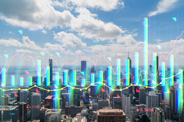 Chicago skyline with graphic financial hologram, futuristic cityscape with digital double exposure....