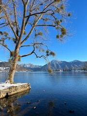 Sunny winter day at the lake with mountain view