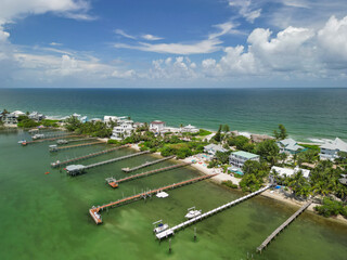 Aerial coastline view and river front houses at Stuart Rocks Beach in Stuart, Florida in Martin...