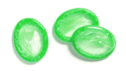 Green condoms isolated on white