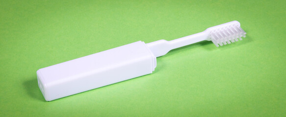 Simple toothbrush, isolated on green