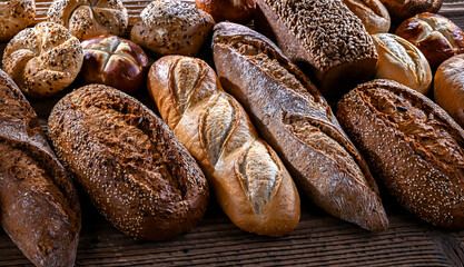 Assorted bakery products including loaves of bread and rolls