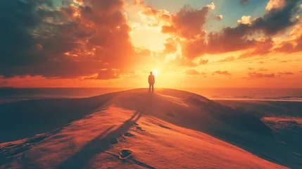Foto op Plexiglas  A man is standing on a dune at sunset looking out over the desert. stunning desert landscape at golden hour.  © Delta Amphule