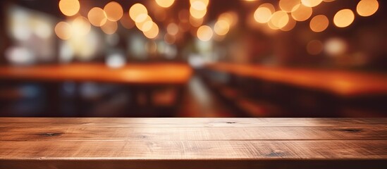A rustic wooden table is set against a background of soft, blurred lights creating a warm and inviting ambiance - obrazy, fototapety, plakaty