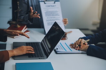 Fototapeta premium Businessman and lawyer discuss the contract document. Treaty of the law. Sign a contract business.