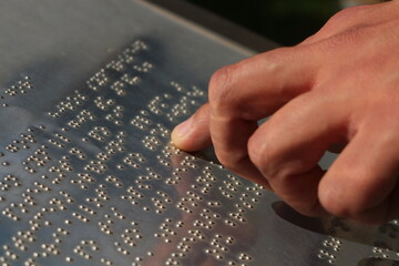 Touch of Understanding: Hands Reading Braille Language