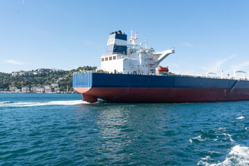 Fototapeta premium Aerial view of a large, loaded container cargo ship traveling