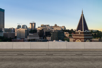 Empty urban asphalt road exterior with city buildings background. New modern highway concrete construction. Concept way to success. Transportation logistic industry fast delivery. Seattle. USA.