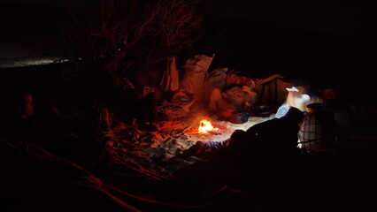 Camp fire at night in the Sahara Desert, outside of Douz, Tunisia