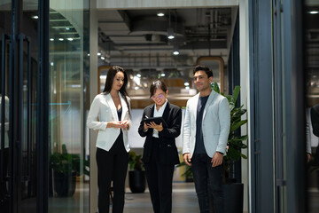 Business meeting - Meeting and talk about work while walking in the office hall. Group of friends meeting at home. Diverse business people asian woman and caucasian man discussion