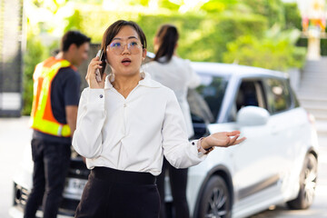 business woman calling to roadside service for help breakdown car on street. roadside assistance and auto insurance service.