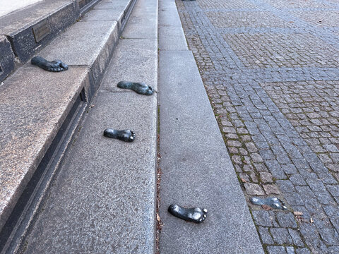 Feet on the stairs at the Synagogue of Pilsen (Plzen). Czechia